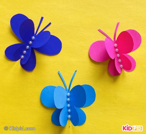 Bright paper butterflies decorated with pearls