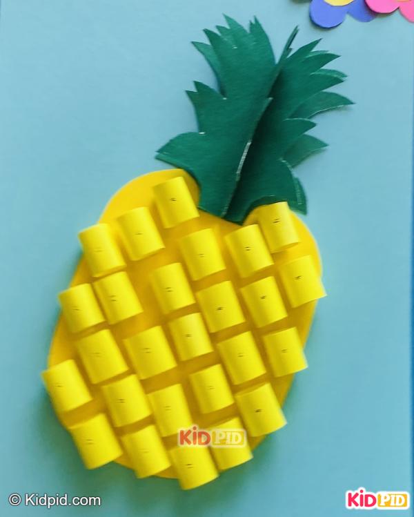 yellow pineapple paper craft with green leaves
