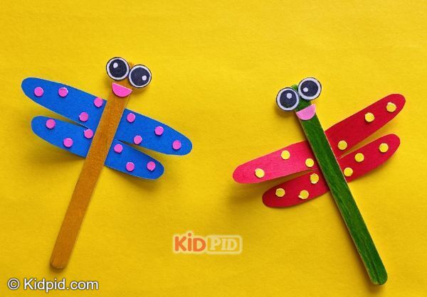 colorful dragonfly craft made with popsicle sticks