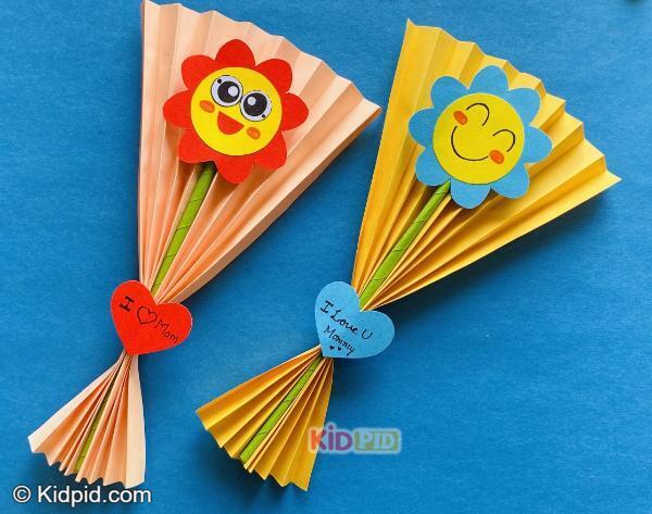 paper fan bouquet craft with smiley flowers