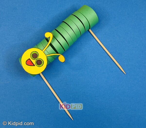 green paper caterpillar toy with sticks