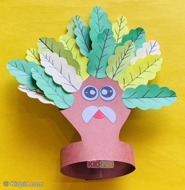 tree face craft with paper leaves